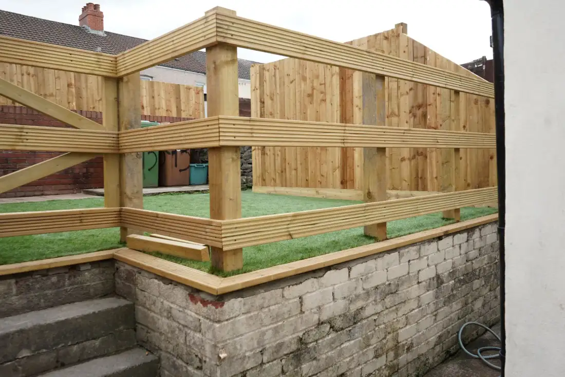 New timber fencing and raised deck frame built by TJB