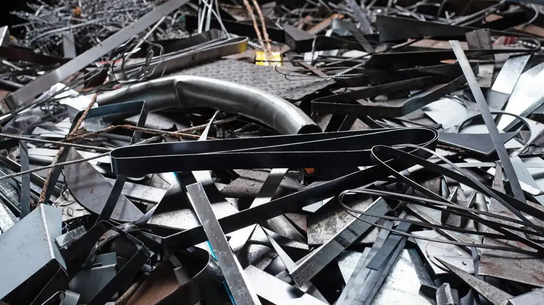 Pile of mixed scrap metal sheets and offcuts