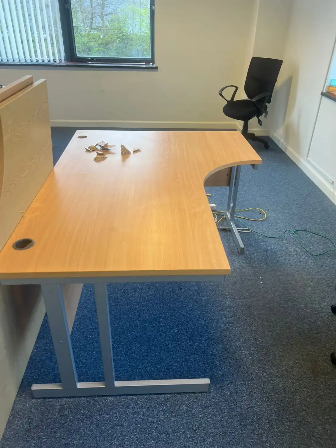 Office desk and chair in an empty office ready for clearance