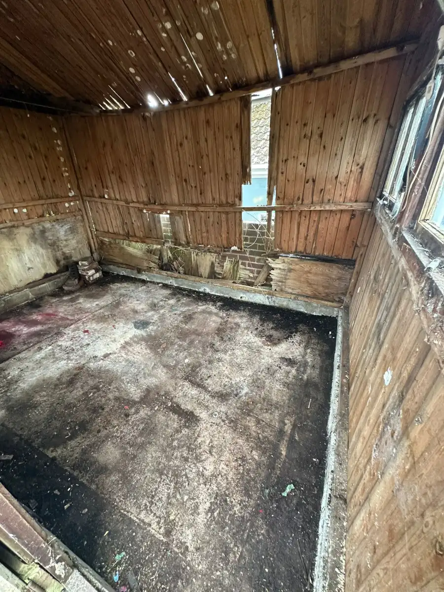 Empty timber shed interior after a clearance
